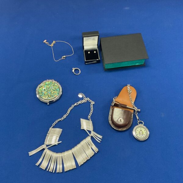 Box of mixed jewellery incl. Royal Hong Kong Police pocket watch, clutch mirror, earrings…