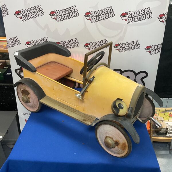 Child’s ride in metal Brum car for restoration