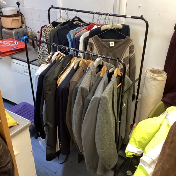 Clothes rail of mens suits & white shirts, jumpers, polo shirts & sweaters all mixed sizes