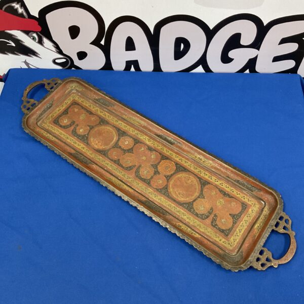 Vintage Indian copper serving tray with embossed details.