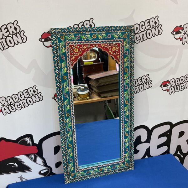 Vibrant blue and turquoise Indian floral mirror for home decor.
