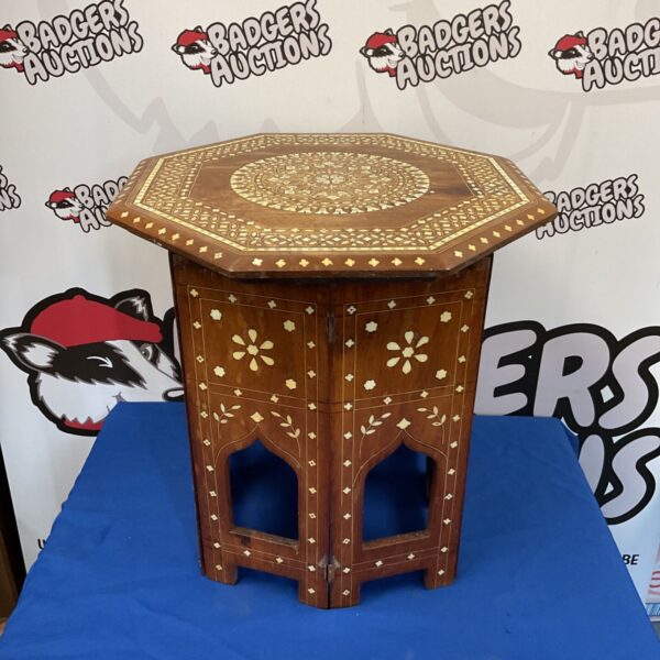 Intricate inlaid Indian hardwood folding table, 46cm diameter.