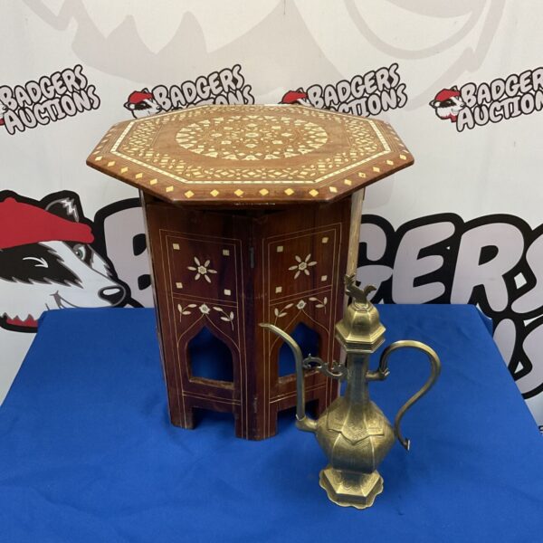 Antique Indian inlaid folding table with brass ewer displayed.