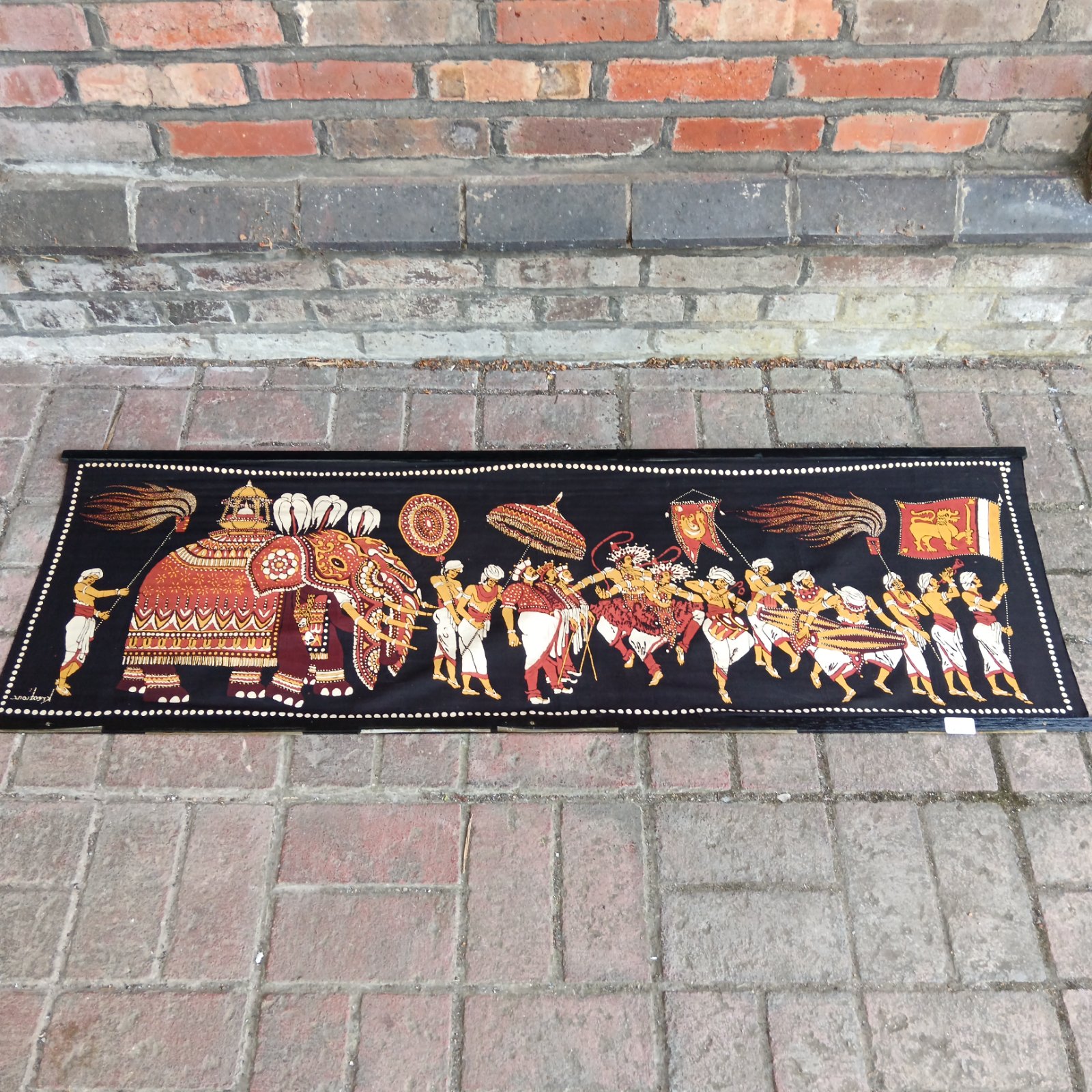 Vibrant Indian royal procession banner with detailed elephant and musician imagery.