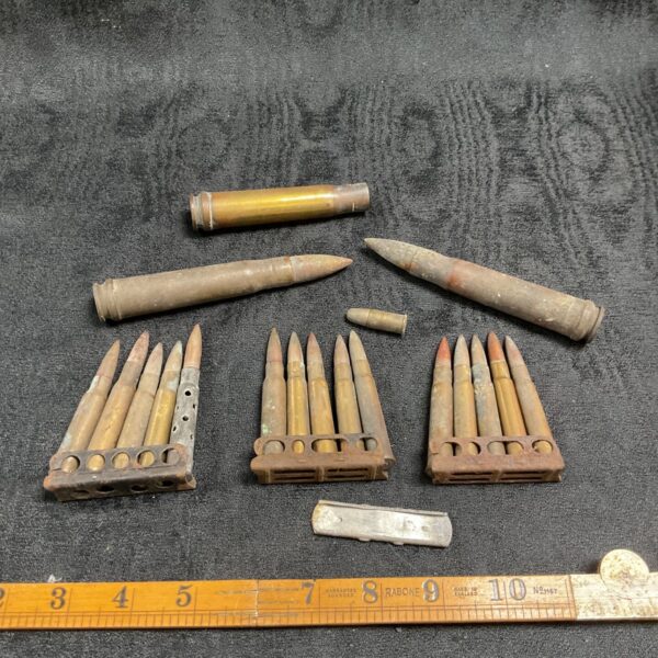 Vintage .30-06 rifle shells in clips, a collectible display item.