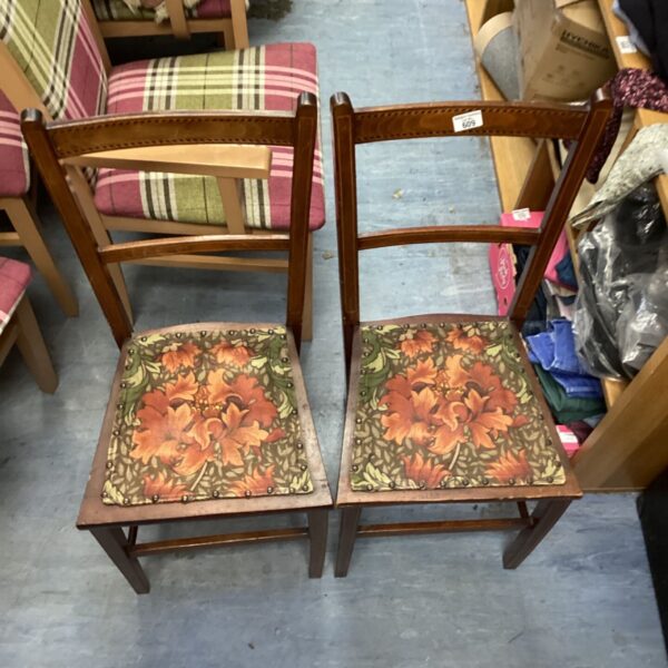 Pair of antique inlaid chairs with patterned seats.