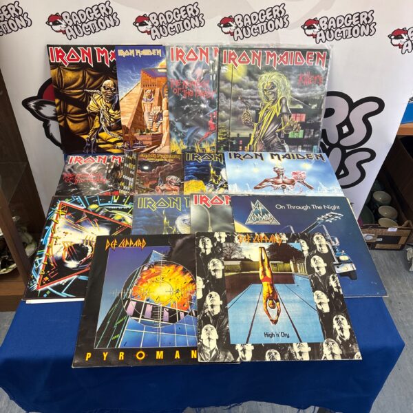 Collection of Iron Maiden and Def Leppard vinyl records for collectors.