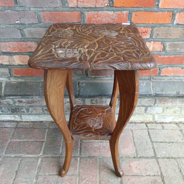 Antique Japanese carved lamp table with floral design.
