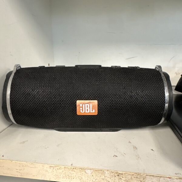 Grey JBL Charge 3 Bluetooth speaker, portable wireless audio.