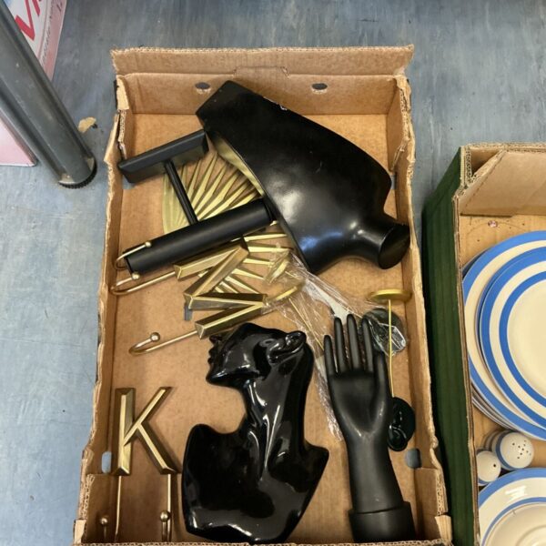 Collection of jewellery display items including a mannequin head and brass stands.