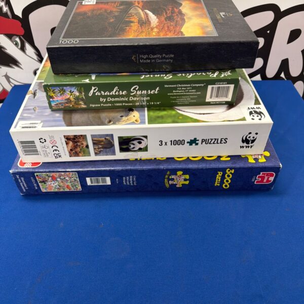 Jigsaw puzzle lot including WWF and Ulmer puzzles.
