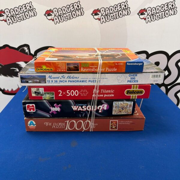 Mixed lot of jigsaw puzzles including Falcon and Ravensburger brands.