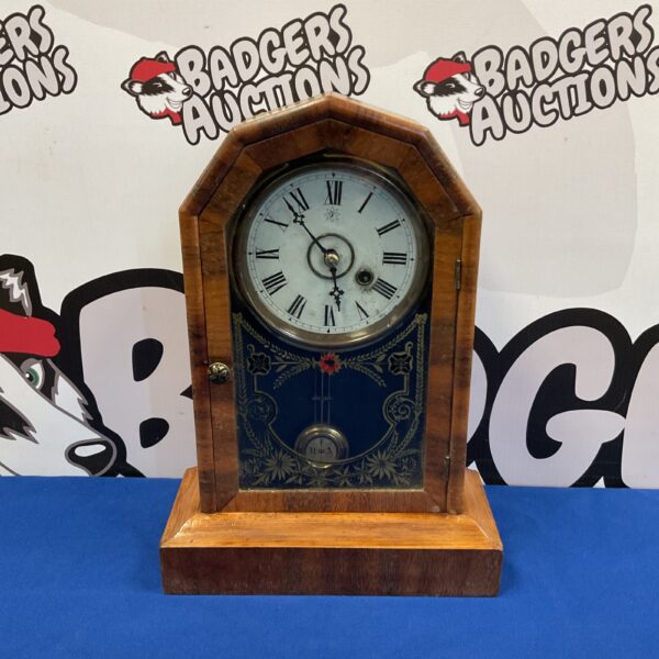 Antique Junghans mantle clock with glass panel door.