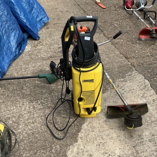 Karcher power washer front view, used garden cleaning equipment.