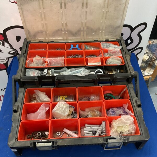 Keter cantilever toolbox with red removable bins for tool storage.