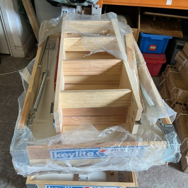 Keylite loft hatch, model KYL, wrapped in plastic.