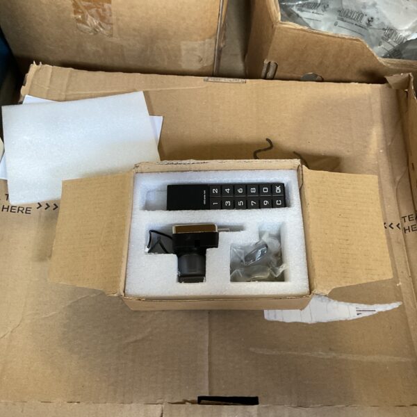 Vertical keypad door lock with round knob for security.