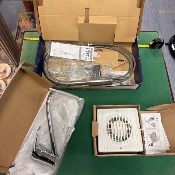 New kitchen mixer taps including a Grohe Start Edge and extractor fan.