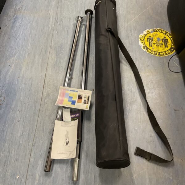 Silver exercise pole with DVD, ideal for home fitness routines.