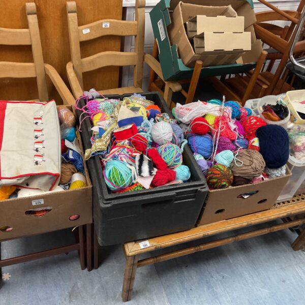 Assorted knitting wool joblot in four boxes, colourful yarn bundles.