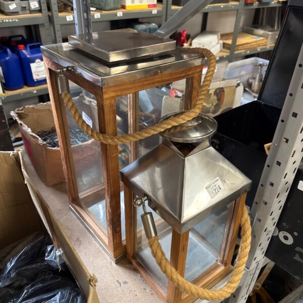 Large wooden candle lantern with rope handle for farmhouse decor.