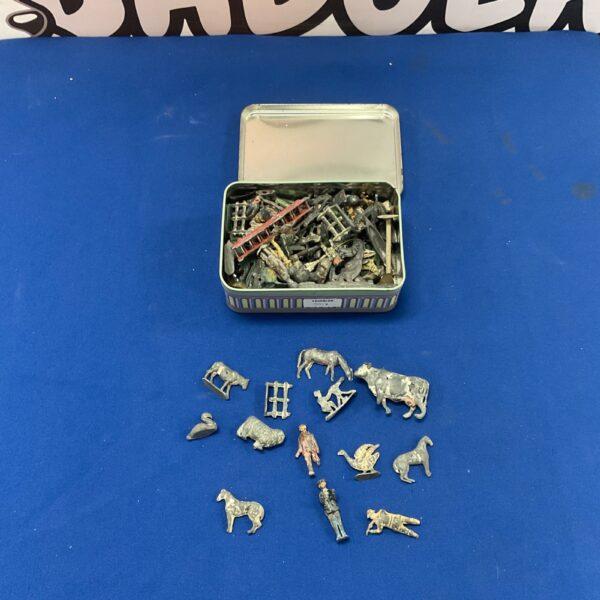 Vintage tin of lead toy soldiers and animals for collectors.