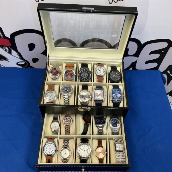 Leather watch display case with a collection of vintage and modern timepieces.