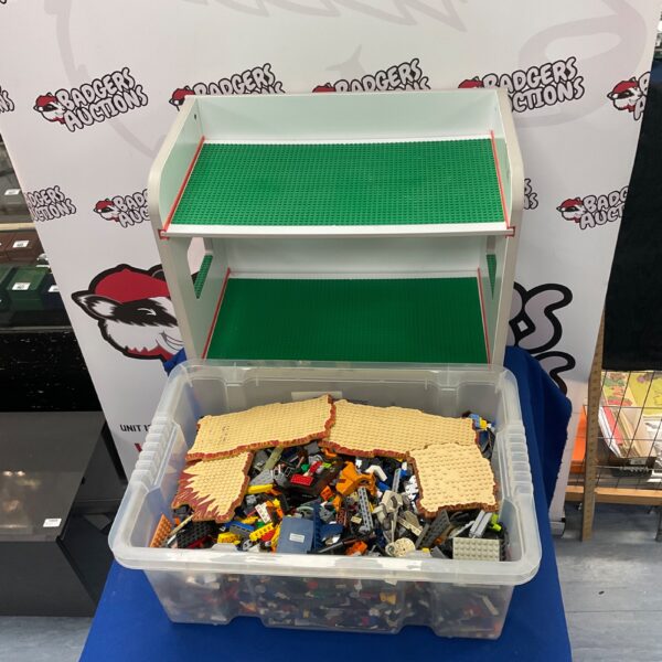 Assorted Lego bricks and tiered board shelves for building and display.