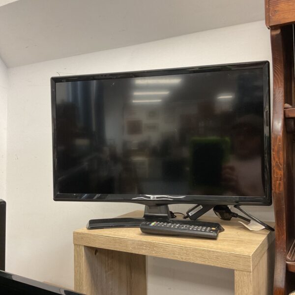 LG 24 inch HD TV with remote control for home entertainment.