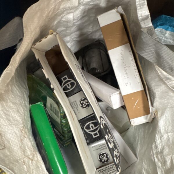 Assorted light bulbs and electronic T8 ballast for vintage lighting.