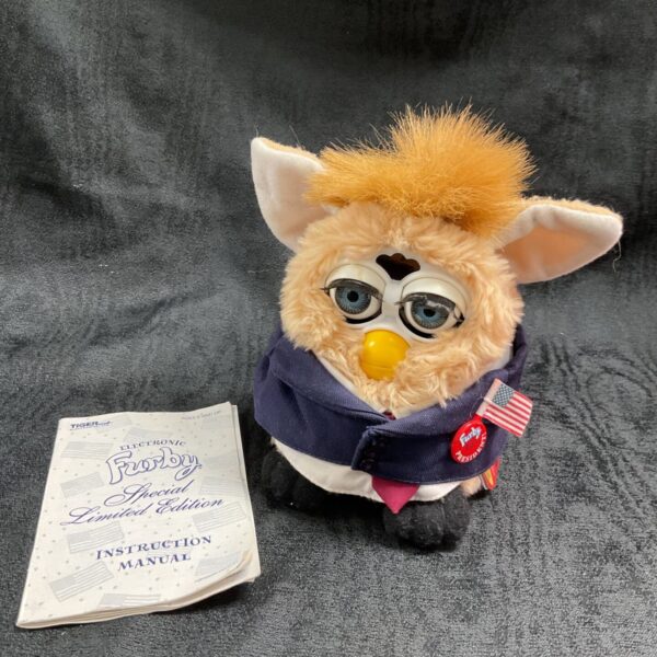 Limited edition Furby wearing a red "Make Furby Great Again" cap.