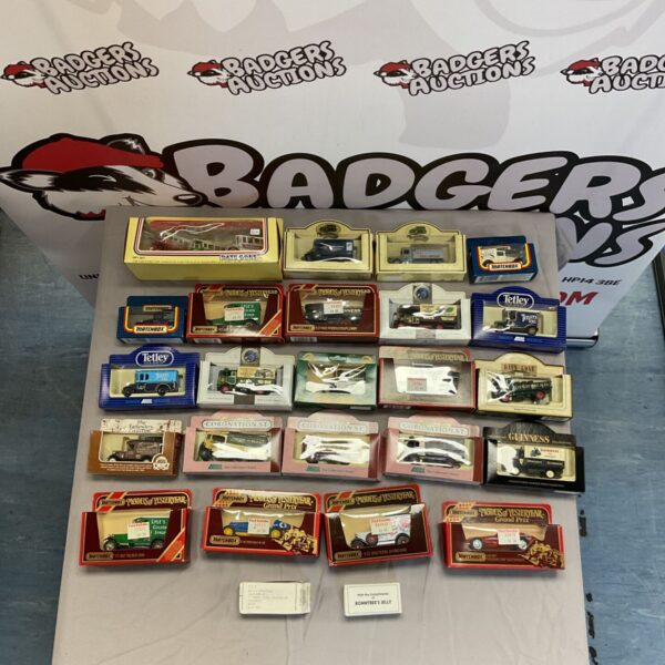 Assorted Lledo and Matchbox diecast models in a box.