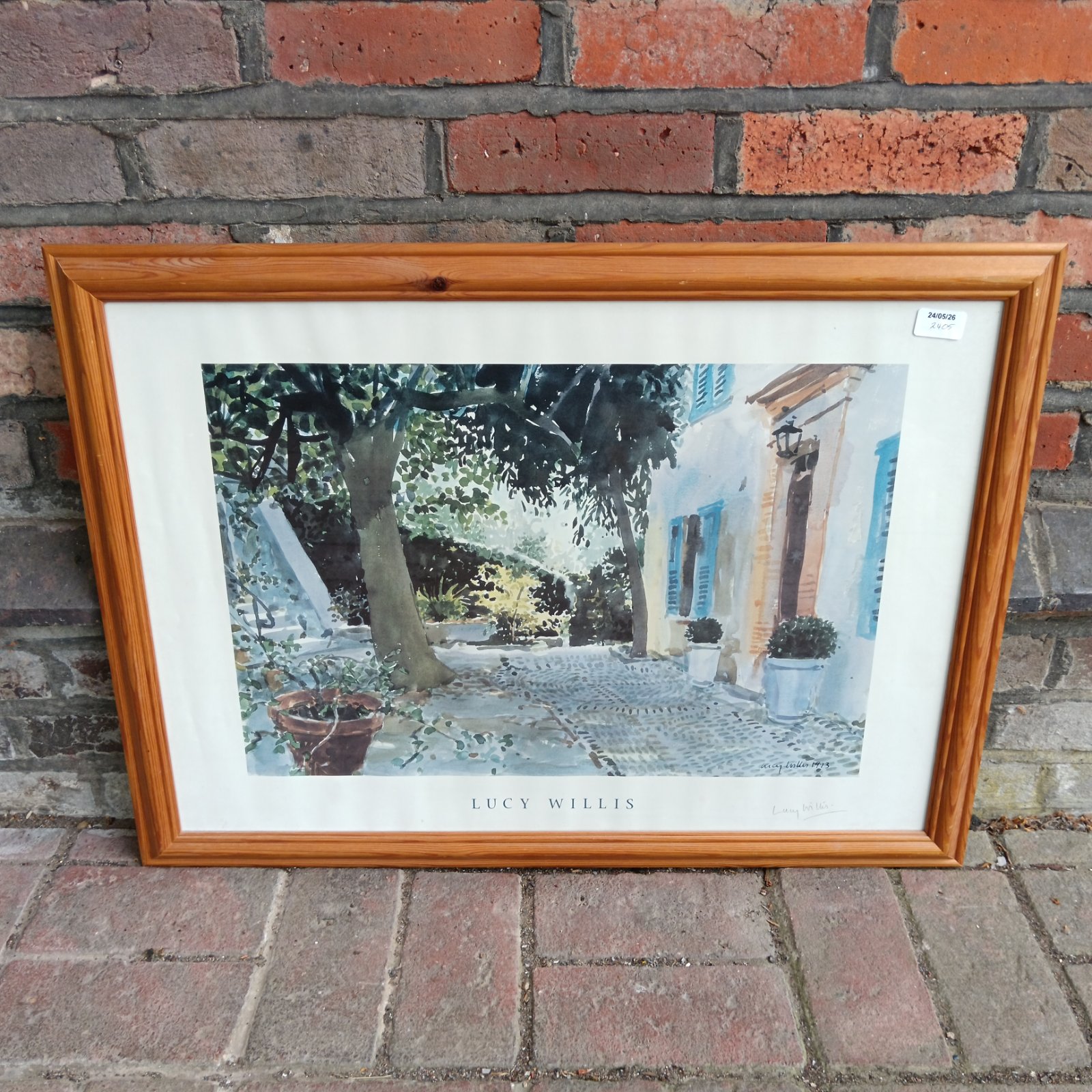 Signed Lucy Willis print of a European street scene.