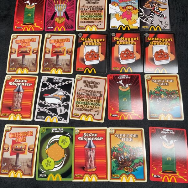 Vintage Macdonalds trade cards collection, colourful fast food memorabilia.