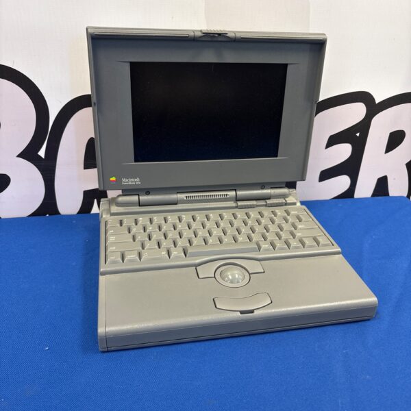 Vintage Macintosh PowerBook 165c laptop in a studio setting.