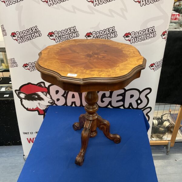 Reproduction mahogany wine table with inlaid top and curved legs.