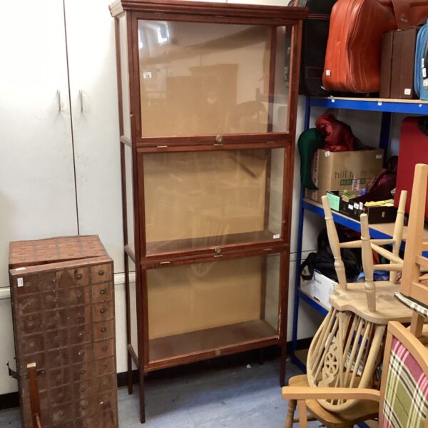 Large mahogany mid-century glass fronted display cabinet for collectibles.