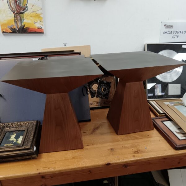 Pair of mahogany pyramid lamp tables in a room setting.