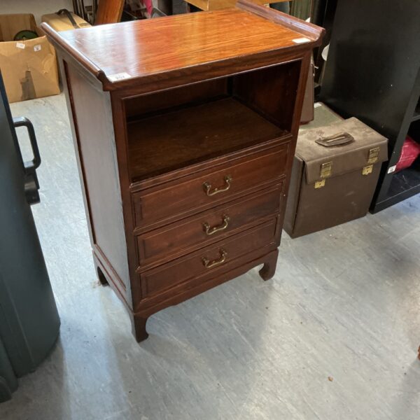 Antique mahogany three drawer cabinet with classic styling.