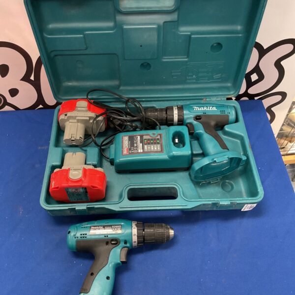 Makita 8390D combi drill kit with batteries and charger in case.