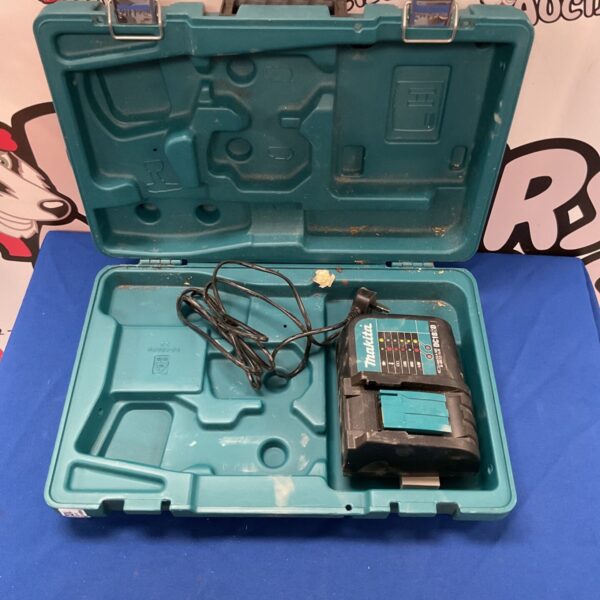 Makita DC18SD charger in original plastic tool case.