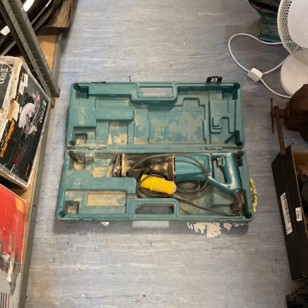 Makita reciprocating saw in original carrying case, showing signs of wear.
