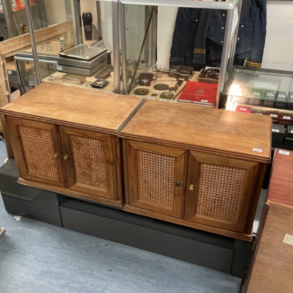 Vintage mango wood cupboard with rattan doors for storage.
