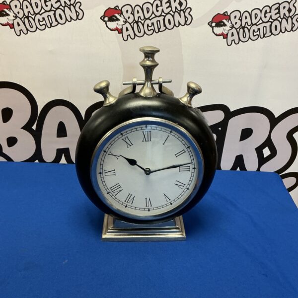 Vintage mantle quartz clock with stopwatch style design.