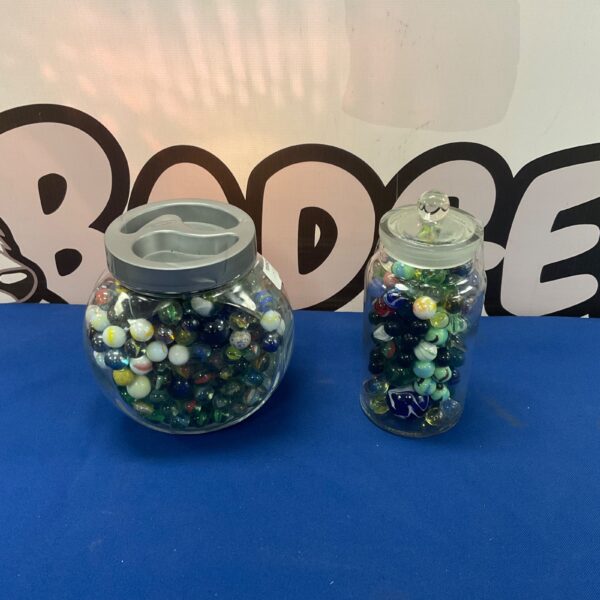 Colourful collection of vintage glass marbles in jars.