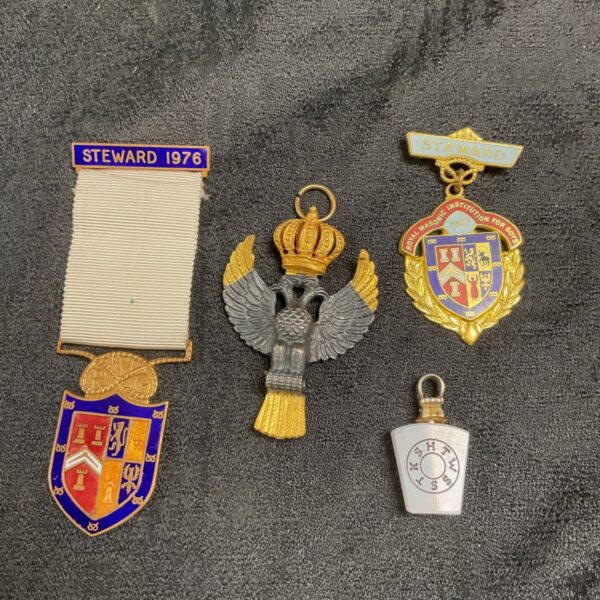 Vintage 1976 masonic steward jewel with ornate detailing and blue ribbon.