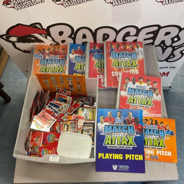 Match Attax trading card album with assorted cards.