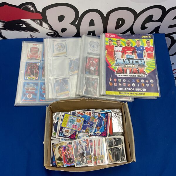 Match Attax trading card binders and box with football cards.
