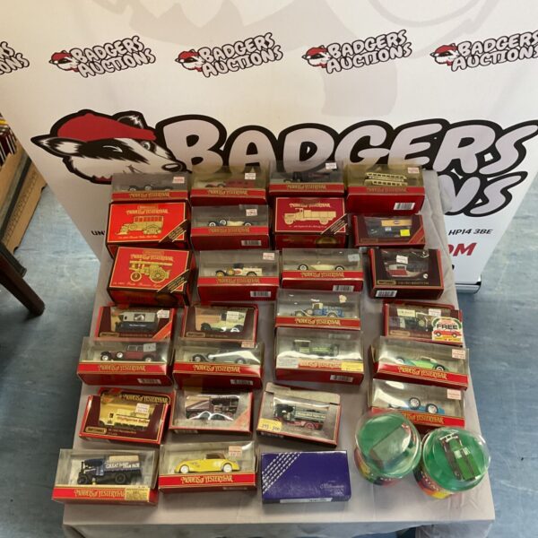 Vintage Matchbox Models of Yesteryear diecast cars and trucks, including Wine Gums.