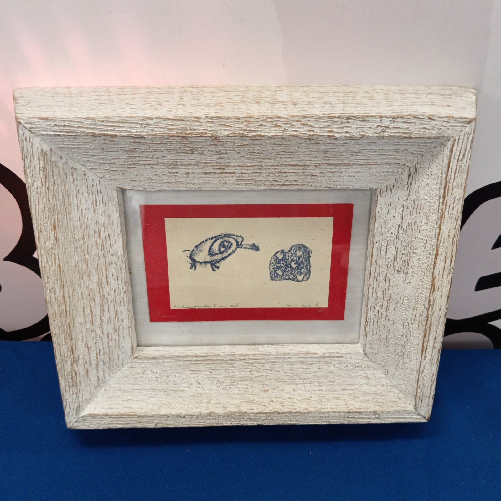 Framed Max Ernst style print with abstract design.